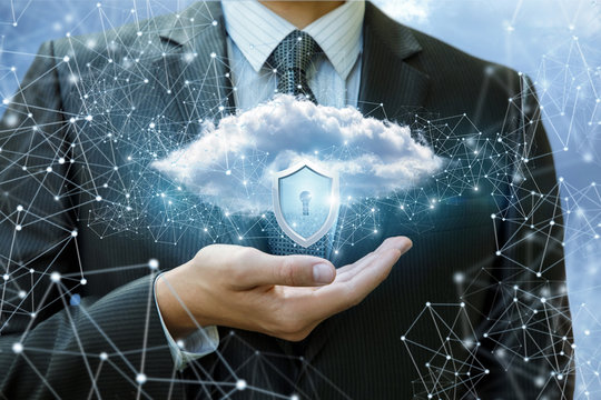 Data cloud with a protective shield in the hand.