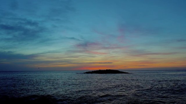 Sunset over small island in the Mediterranean