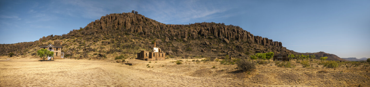 Old abandoned ruins in a desert landscape.
