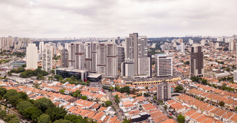 Aerial view of Sao Paulo with buildings and houses on cloudy winter day.