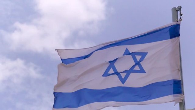 Slow motion video a flag of Israel fluttering in a strong wind