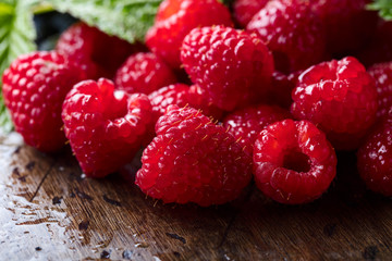  Ripe and juicy fresh picked raspberries .