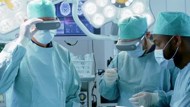 Surgeons Put on Augmented Reality Glasses to Perform State of the Art Surgery in High Tech Hospital. Shot on RED EPIC-W 8K.