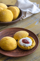 Pumpkin scones with cream and fruit jam