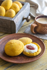 Pumpkin scones with cream and fruit jam