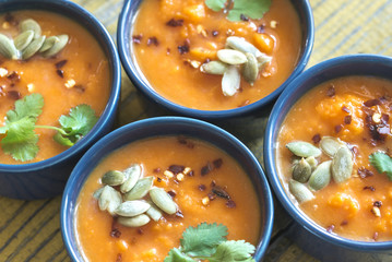 Bowls of pumpkin cream soup