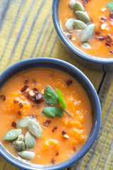 Bowls of pumpkin cream soup