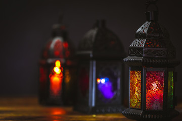 The Muslim feast of the holy month of Ramadan Kareem. Beautiful background with a shining lantern...