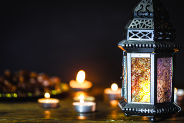 The Muslim feast of the holy month of Ramadan Kareem. Beautiful background with a shining lantern...