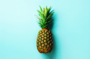 Pineapple on blue background. Top View. Copy Space. Pattern for minimal style. Pop art design, creative concept