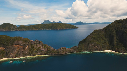 Tropical islands, aerial view. Aerial view: sea and the tropical islands. Tropical bay in El Nido. Archipelago El Nido.Sandy beaches of the wild islands. Philippines National Marine Park. Seascape