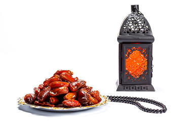 The Muslim feast of the holy month of Ramadan Kareem. Beautiful background with a shining lantern...
