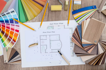 House plan with different swatches on wooden background