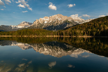 Great reflections of the Kampenwand at Lautersee on sunset