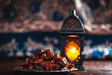 The Muslim feast of the holy month of Ramadan Kareem. Beautiful background with a shining lantern...