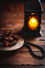 The Muslim feast of the holy month of Ramadan Kareem. Beautiful background with a shining lantern...