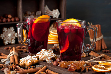 Mulled wine with slice of orange and spices
