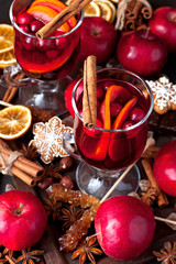 Glass with mulled wine and spices
