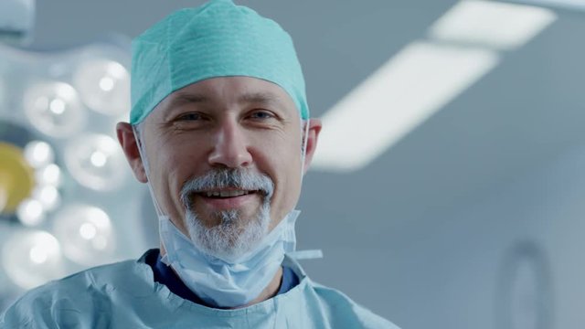 Portrait of the Professional Surgeon Taking off Surgical Mask after Successful Operation. Shot on RED EPIC-W 8K Helium Cinema Camera.