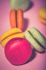 Close up colorful macarons dessert with vintage pastel tones