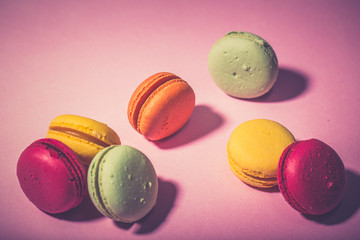Close up colorful macarons dessert with vintage pastel tones