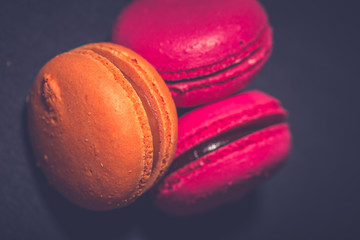 Close up colorful macarons dessert with vintage pastel tones