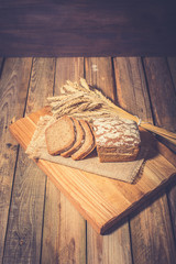 Fototapeta na wymiar Slices of finest organic bread decorated with natural cereals