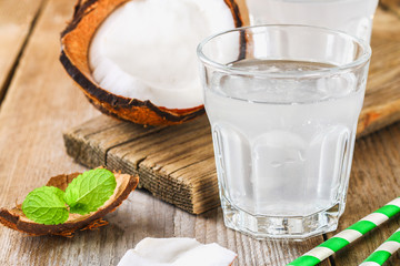 Fresh Organic Coconut Water in a Glass. Food background, selective focus.