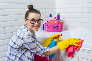 House cleaning. Woman is cleaning in the bathroom at home.