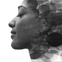Paintography. Double Exposure portrait of a seductive ethnic woman's profile combined with hand drawn watercolor painting. black and white