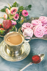 Hot chocolate in a beautiful Golden Cup with a pink marshmallow home made
