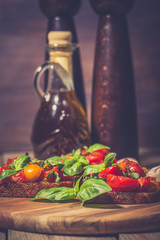 Bruschetta with tomatoes, herbs and oil on toasted garlic bread