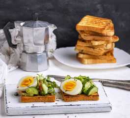 pieces of bread from white wheat flour with boiled egg