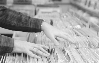 Hipster searches record store for rare vinyl