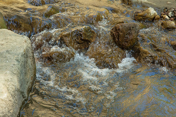 Russia. North Caucasus. Chegem waterfalls. Flowing through the rocks mountain river