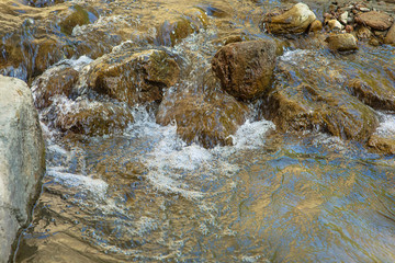 Russia. North Caucasus. Chegem waterfalls. Flowing through the rocks mountain river