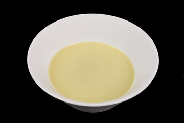 Healthy spinach soup on a black