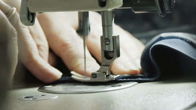 Slowly view of stitching a jacket with sewing machine