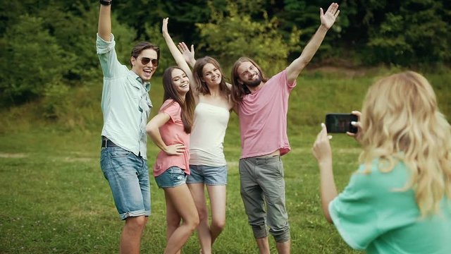Happy Friends Taking Photos On Phone In Nature.