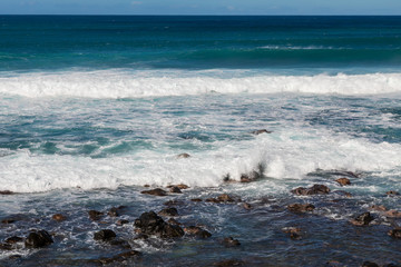 Waves Crashing Ashore Along the Scenic Maui Coast