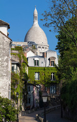 Beautiful view of Montmartre street and the Sacre-Coeur basilica in the background, France.