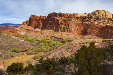 Capitol Reef National Park. Located in south-central Utah, Capitol Reef National Park is a hidden treasure filled with cliffs, canyons, domes and bridges in the Waterpocket Fold.