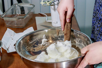 hands folding batter together
