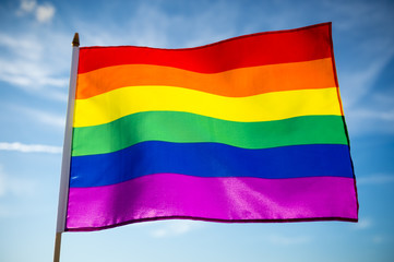 Gay pride rainbow flag flutters in the breeze.