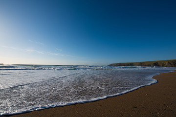 Slow waves on a sandy beach