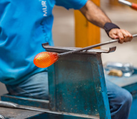 Pocos de Caldas, Minas Gerias/Brazil. Man shapping a crystal glass handicraft piece