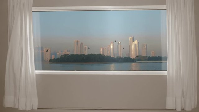 View from window skyscrapers in city on sea shore and birds in sky. Background plate, chroma key video background