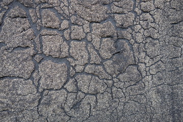 Old felt roofing tar fragment as an abstract background