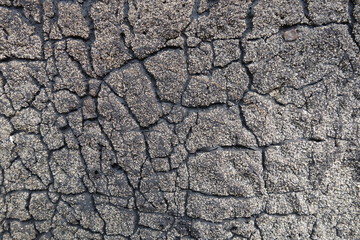 Old felt roofing tar fragment as an abstract background