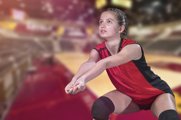 Female professional volleyball player on grand court
